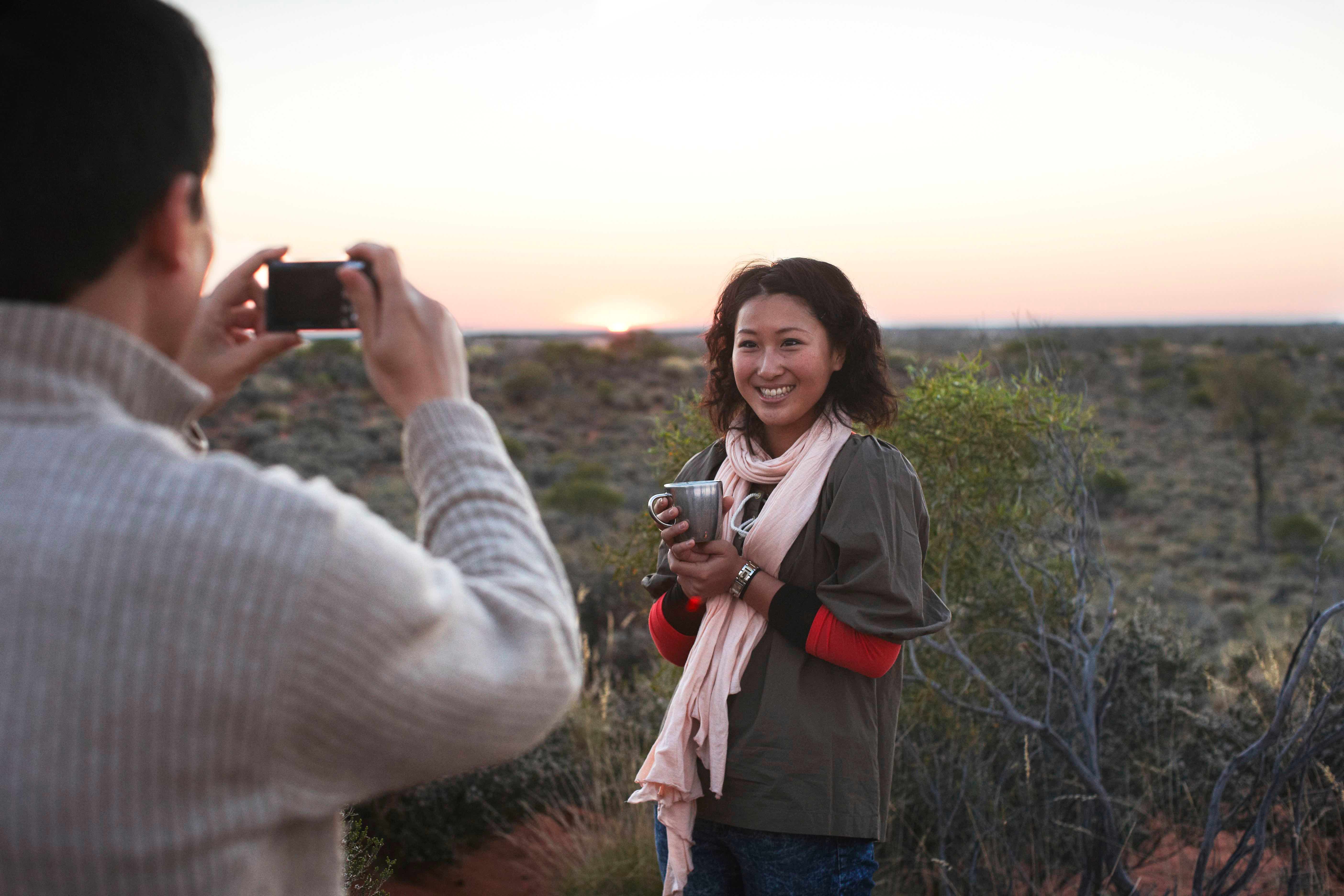 Couple taking photo in outback