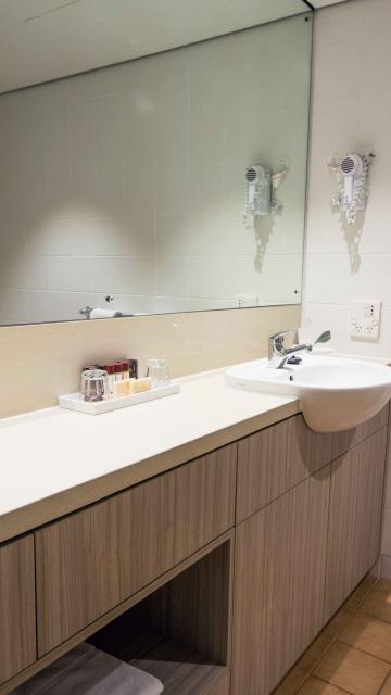 hotel bathroom with long countertop