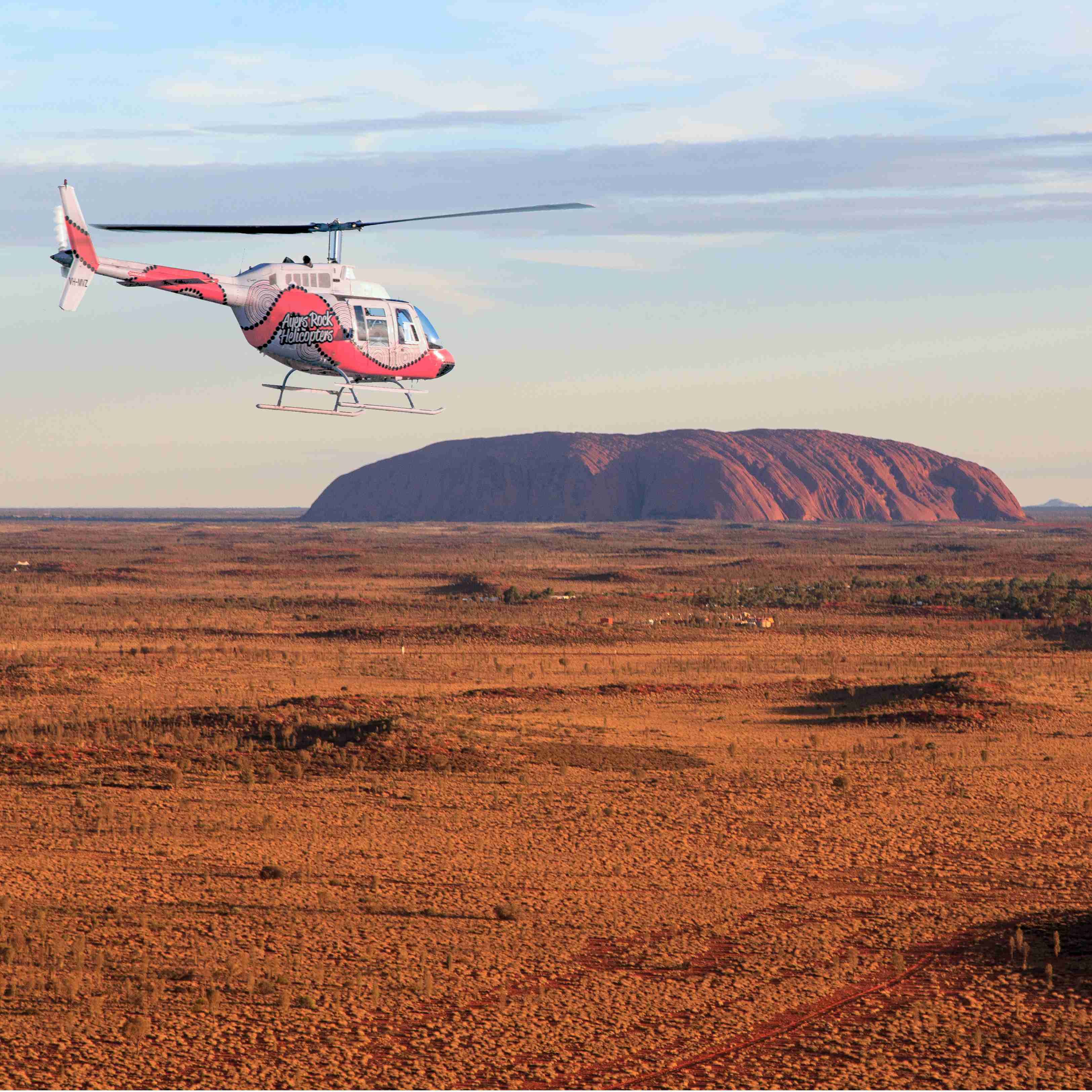 Helicopter above Ayers Rock