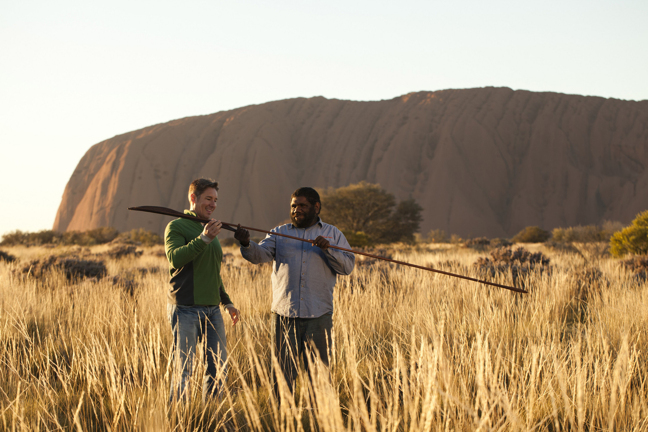 A man and a guide looking at a spear | Uluru Australia | Uluru Rockies | Mossmangor Indigenous Tourism